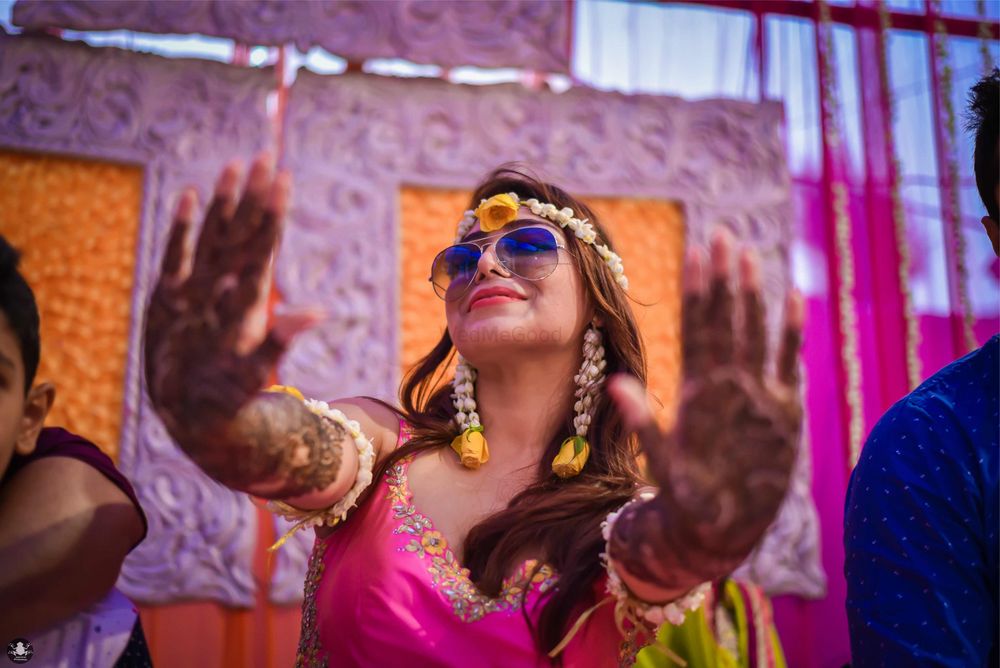 Photo of Fun Bridal Mehendi Portrait with Purple Sunglasses