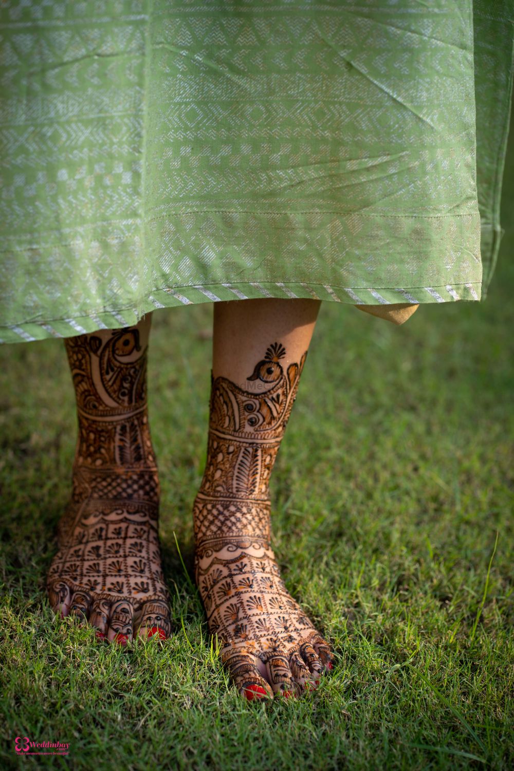 Photo of Feet Mehendi design with peacocks and jaalidaar patterns.