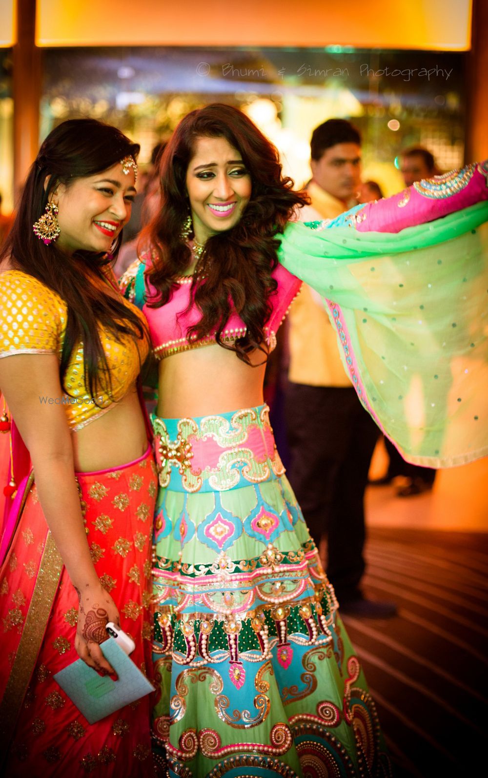 Photo of neon funky kitsch bridal lehenga in aqua and fuschia pink by Manish Arora