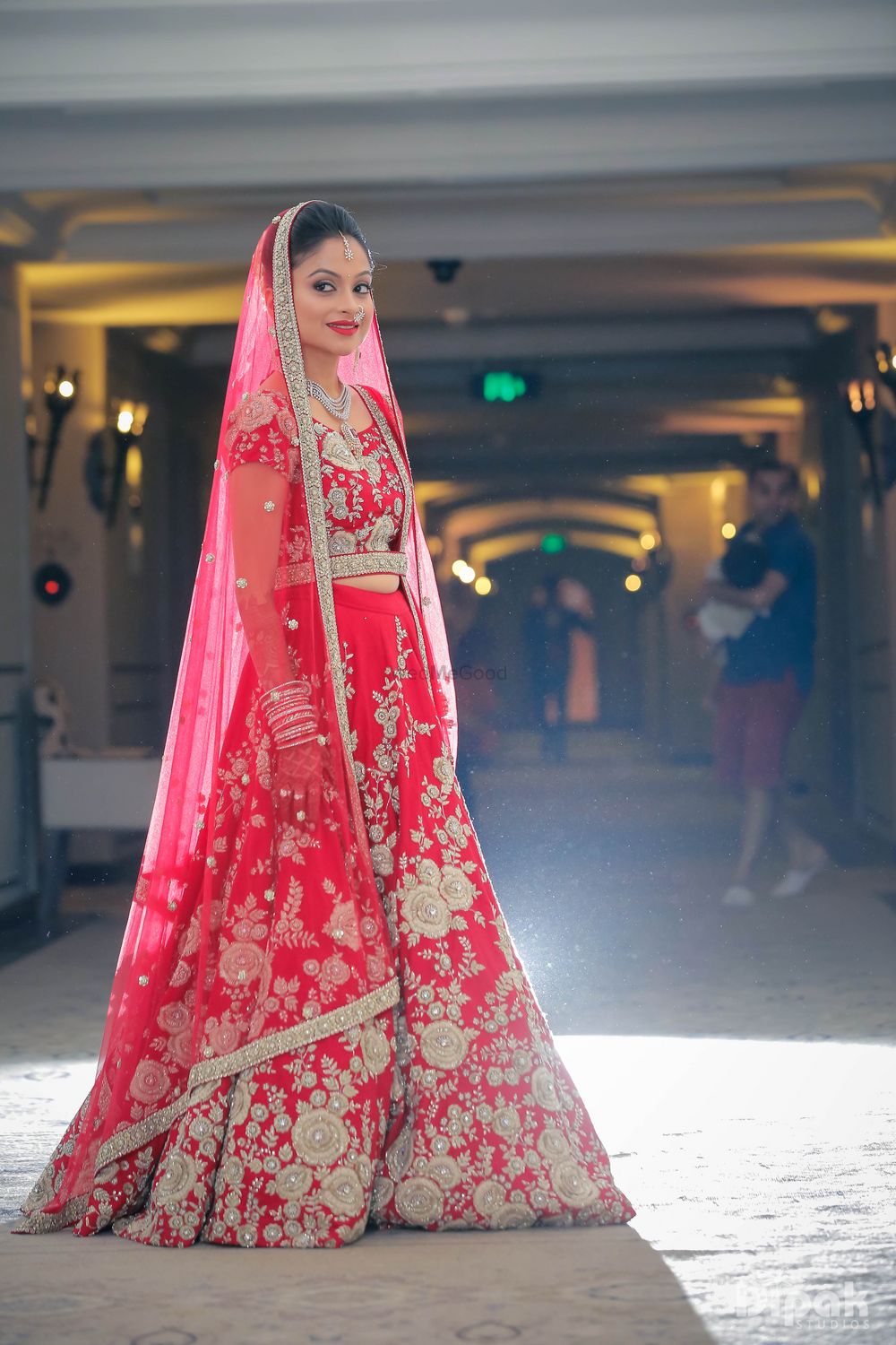 Photo of Strawberry Red Bridal Lehenga with Silver Embroidery