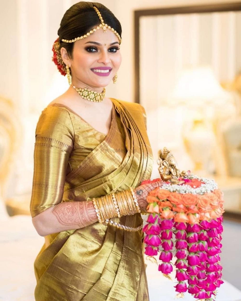 Photo of bride in gold kanjivaram