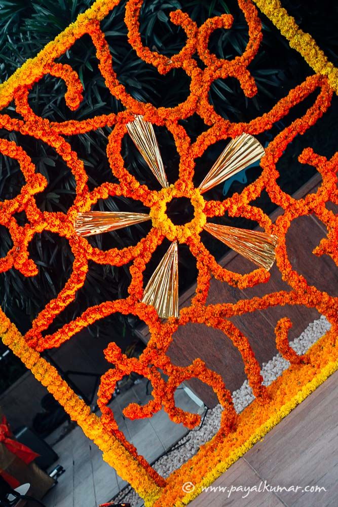 Photo of Genda Phool Arrangement Floral Square Frame