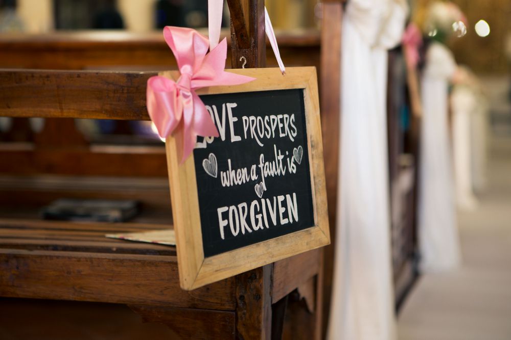 Photo of Chalkboard Love Message at Wedding Aisle