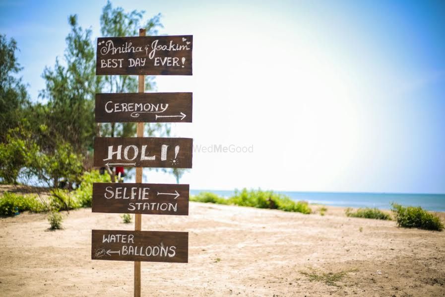 Photo of Fun Chalkboard Direction Board for Beach Wedding