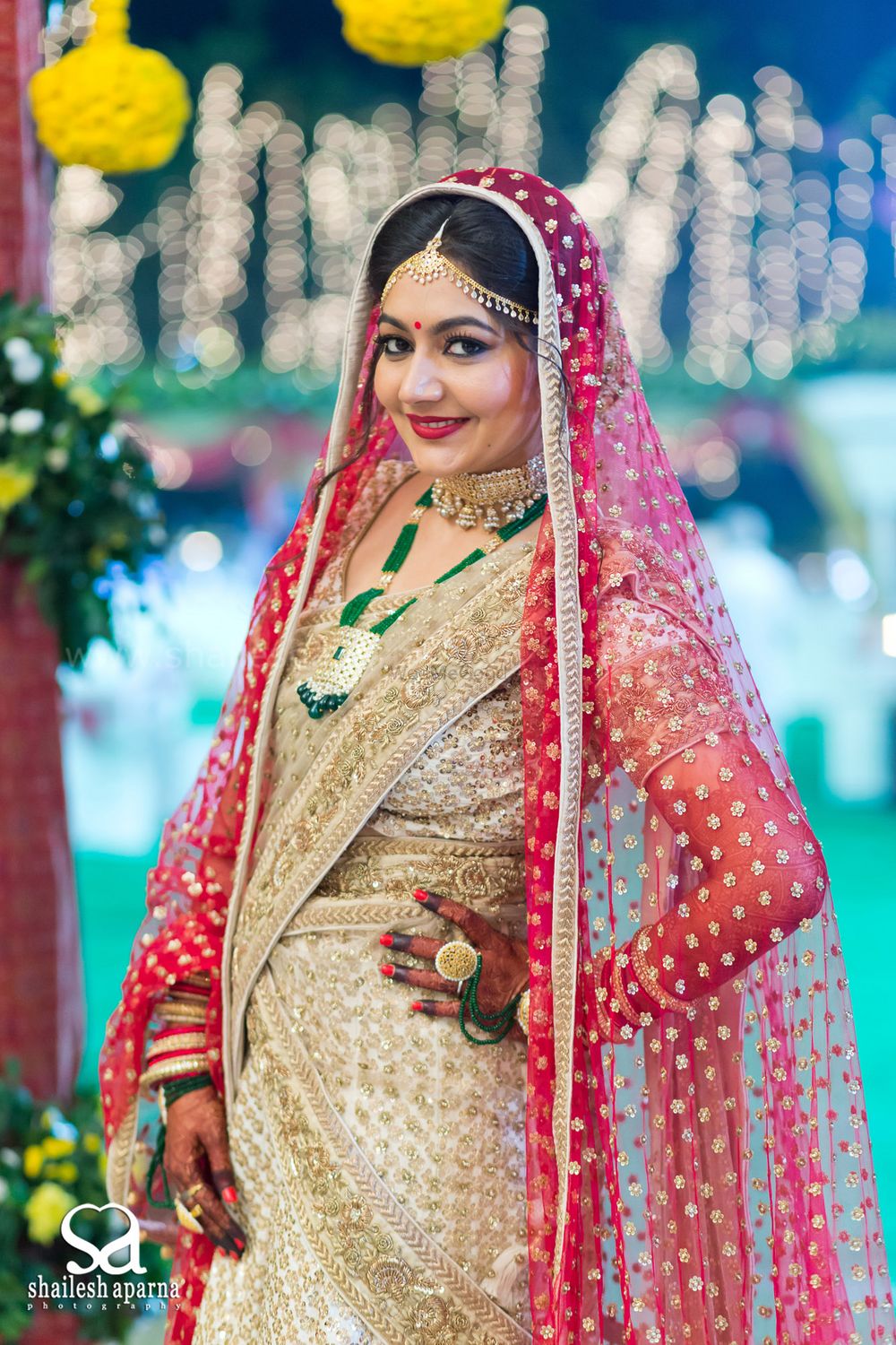 Photo of Bride Wearing Gold and White and Bridal Saree with Red
