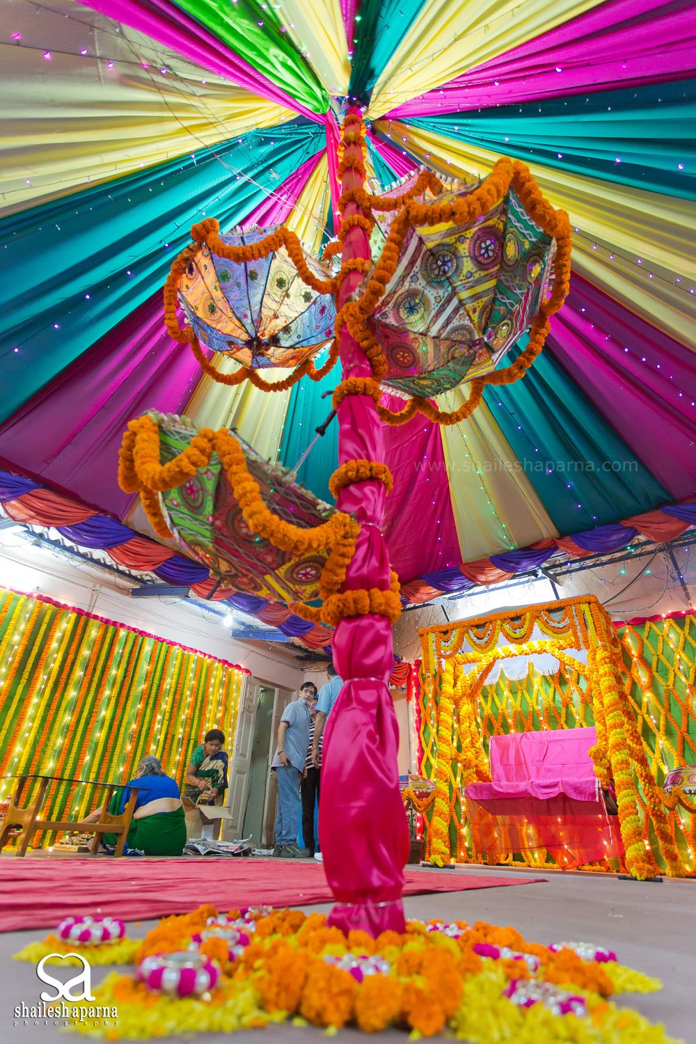 Photo of Colourful Tent Decor with Umbrellas and Genda Phool