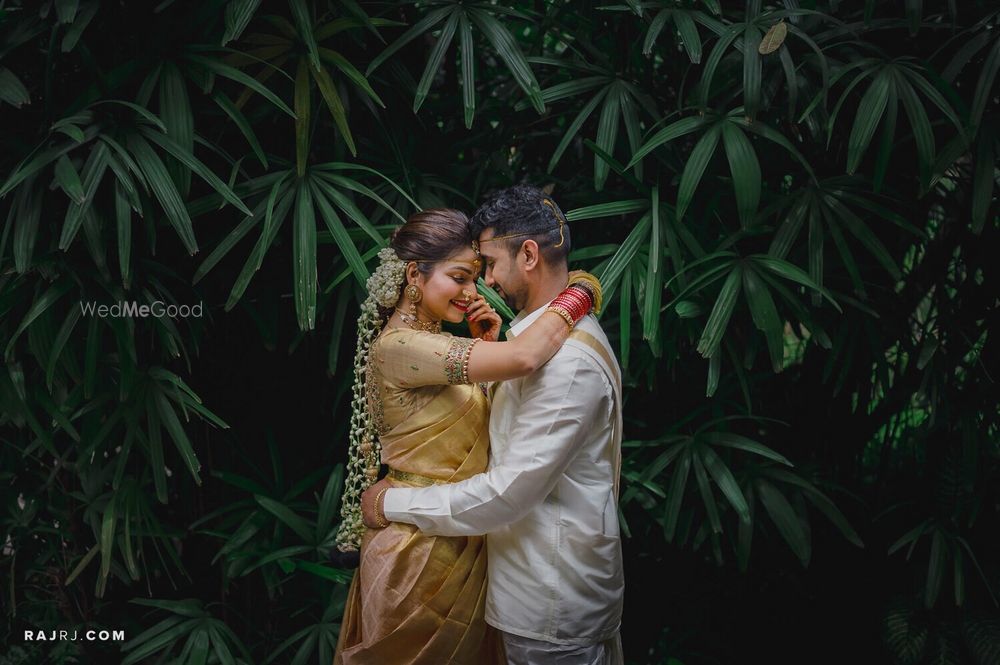 Photo of A romantic couple pose on wedding day