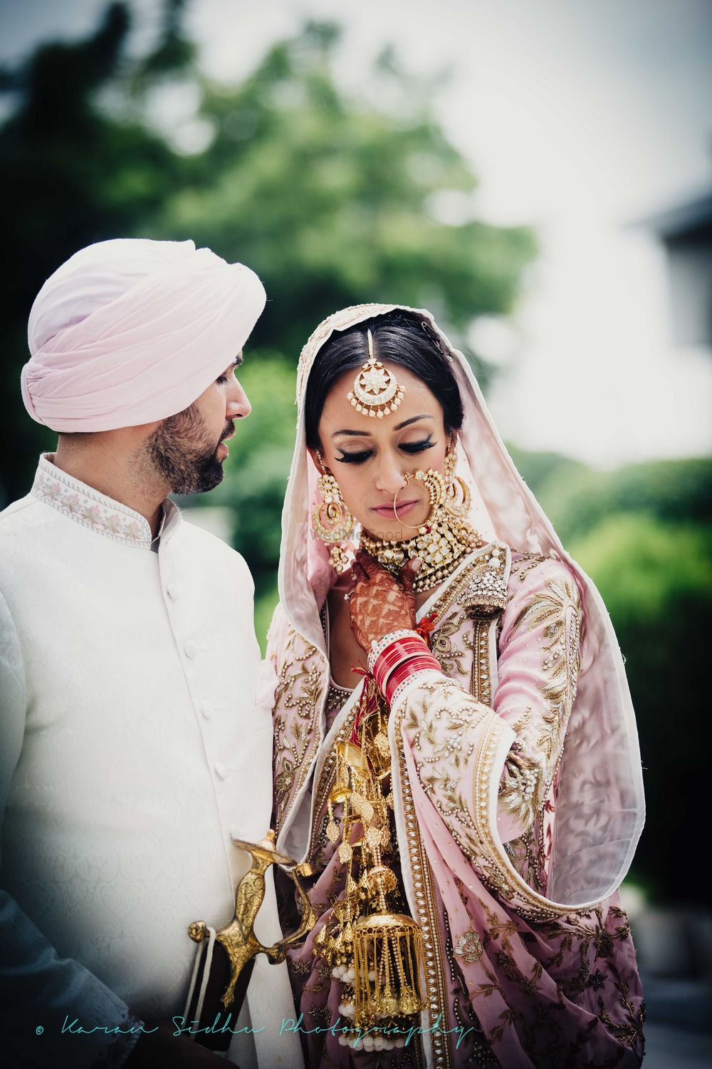 Photo of Pstel pink sikh bride