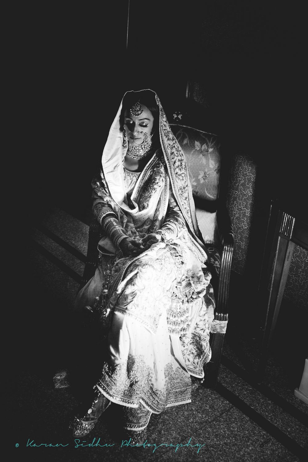 Photo of Black and White Timeless Sitting Sikh Bride Portrait