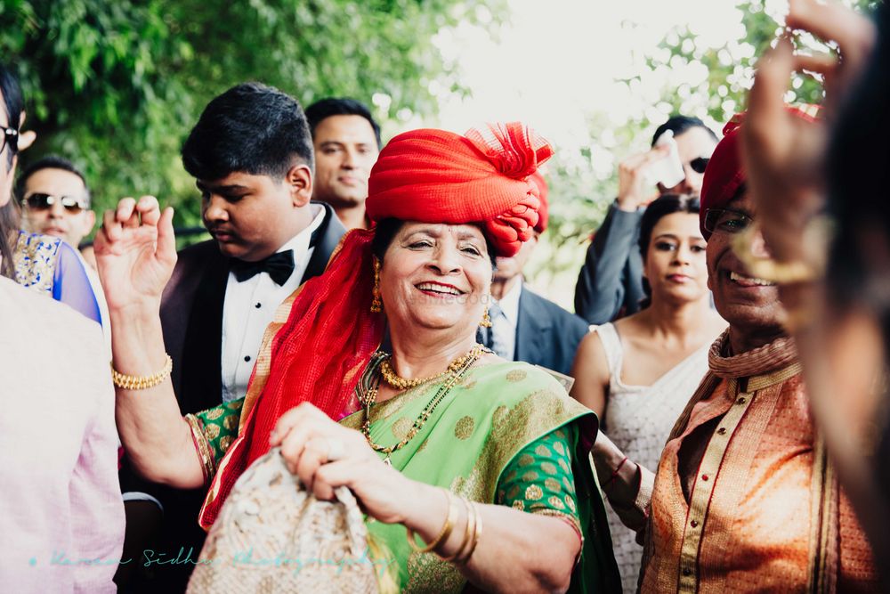 Photo of Grandma with Red Turban Dancing in Baraat