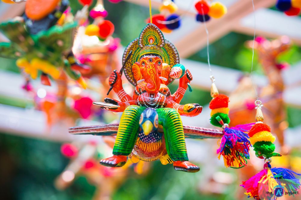 Photo of Colourful Mehendi Decor with Ganeshji and Pompoms