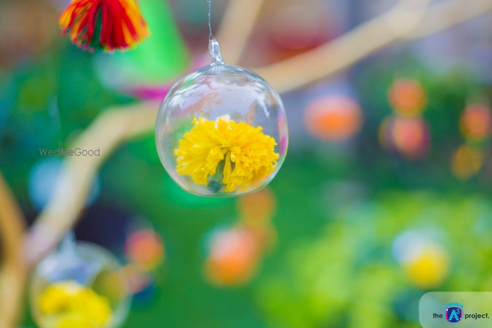 Photo of Suspended Genda Phool Inside Glass Ornament