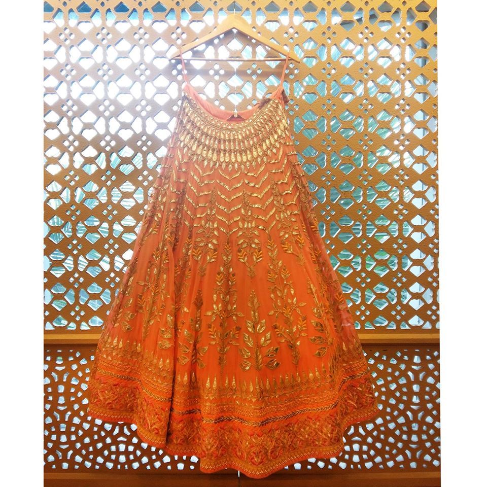 Photo of orange gota patti bridal lehenga