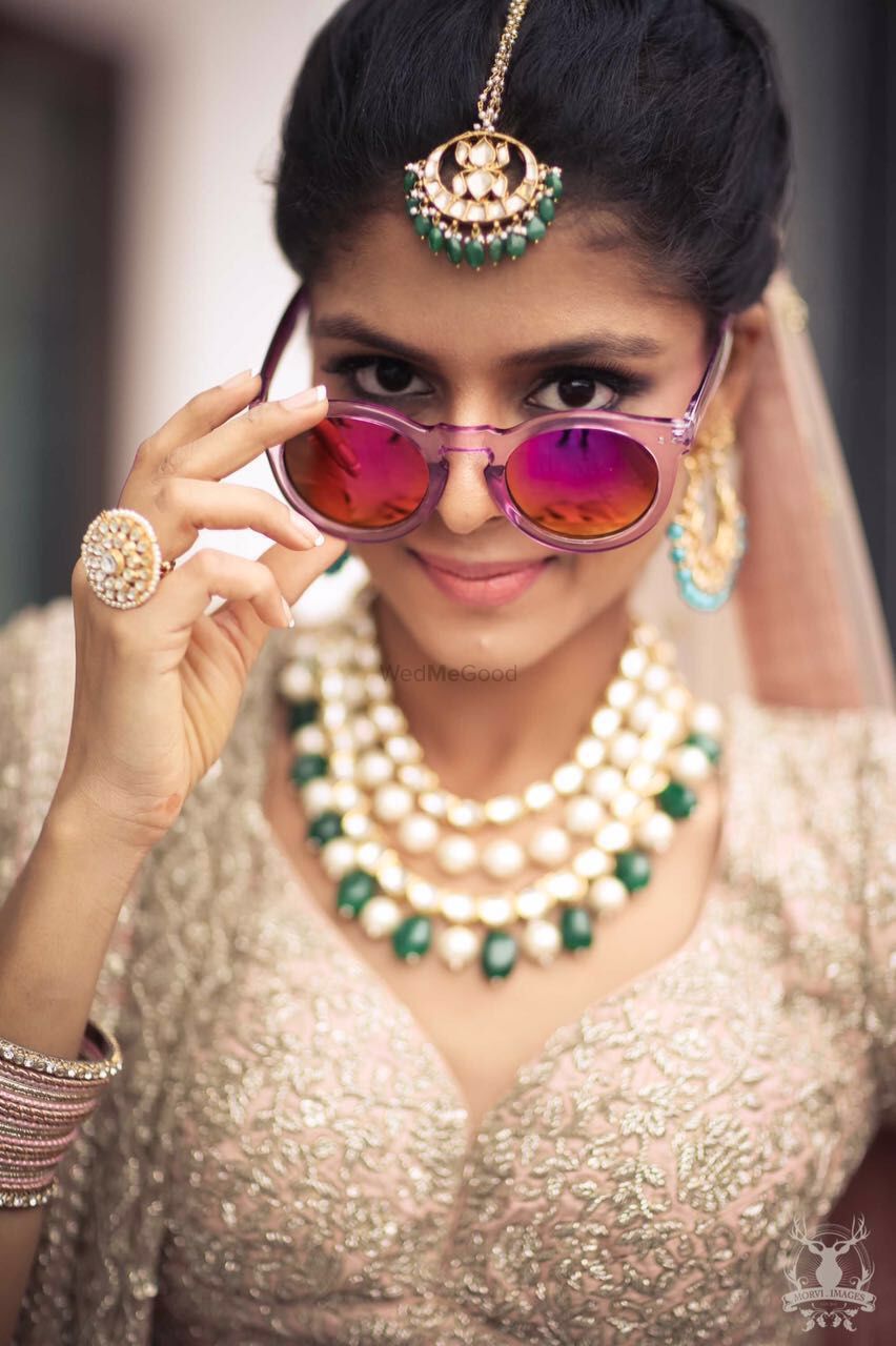 Photo of Fun Bridal Photo with Sunglasses and Contrasting Jewels
