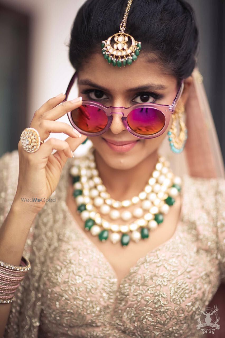 Photo of Fun Bridal Photo with Sunglasses and Contrasting Jewels