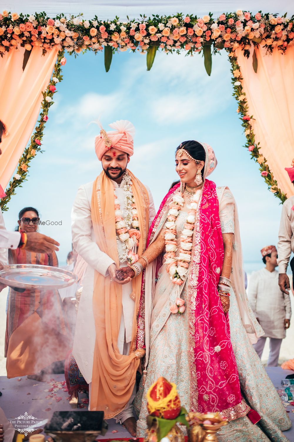 Photo of peach pastel wedding with rose jaimalas