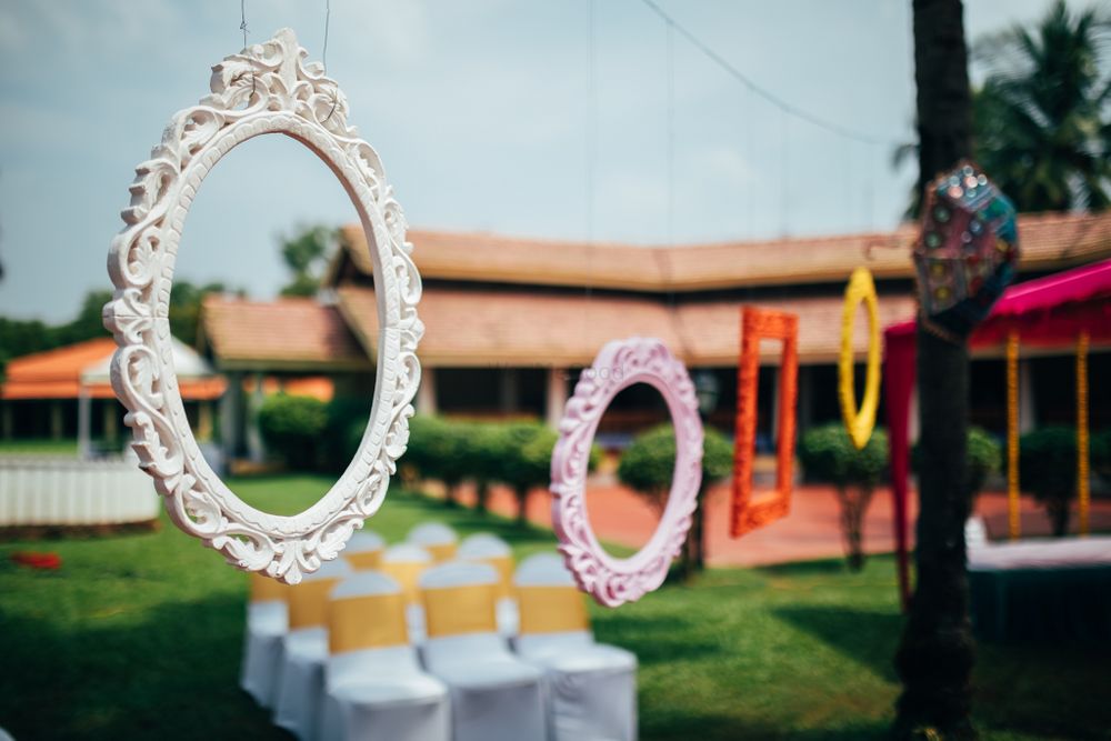 Photo of hanging wooden frames in decor for mehendi