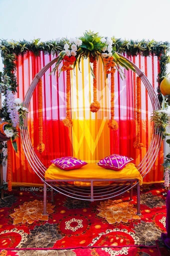 Photo of Minimal Mehendi seating decor for a home function.