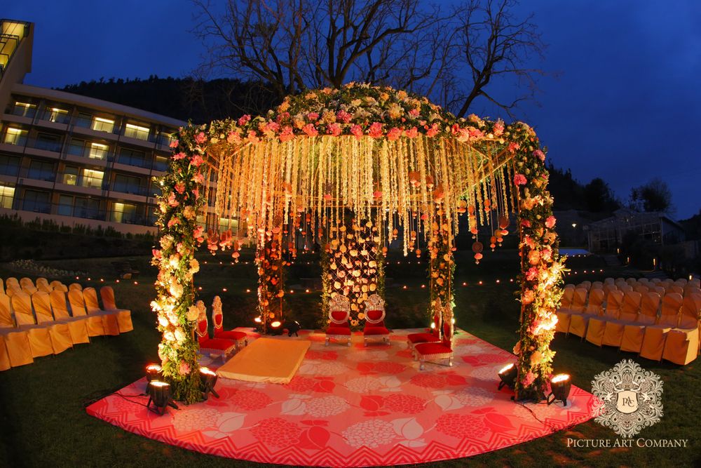 Photo of Colourful Floral Arrangementand Lighting for Mandap