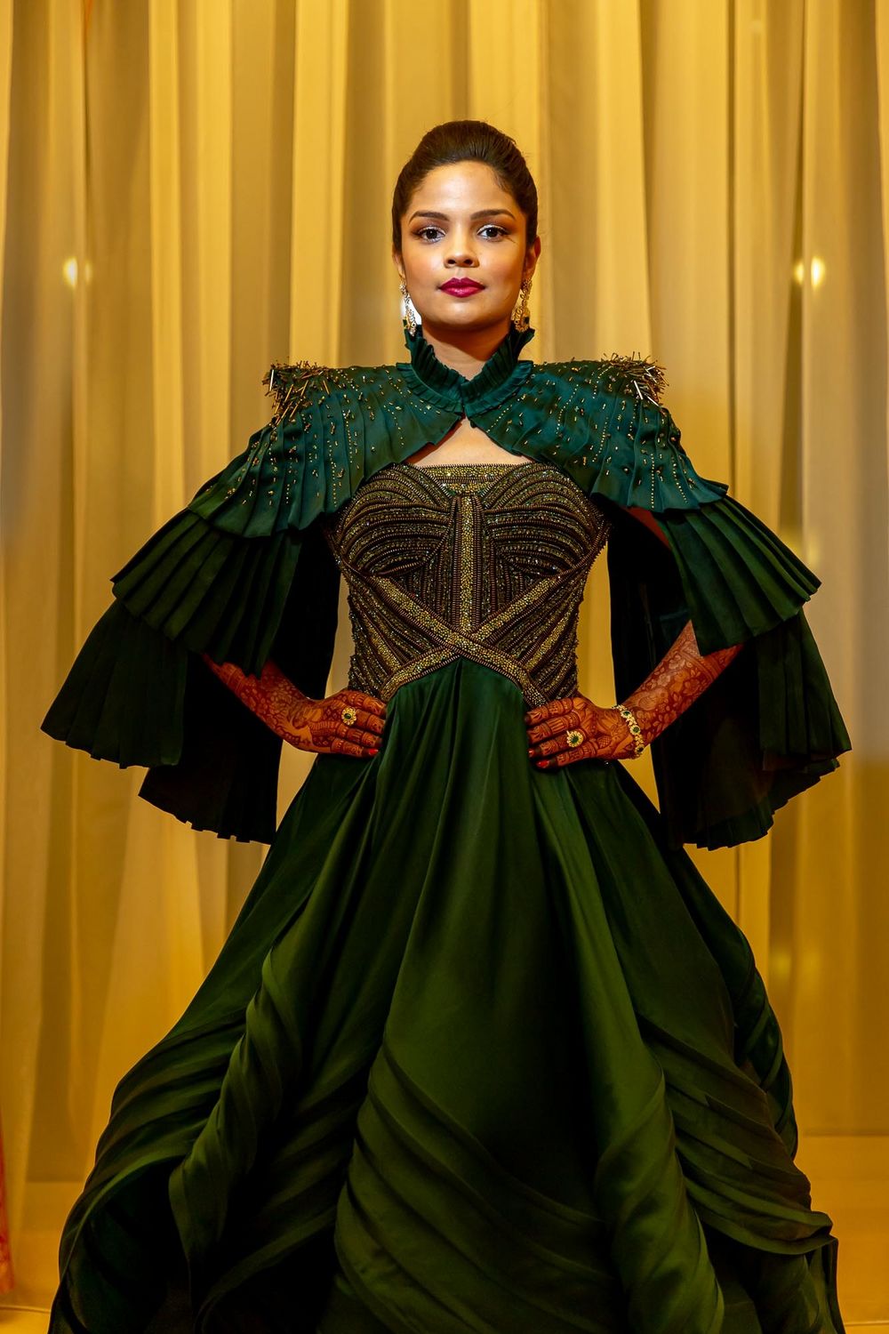 Photo of Bride in a structured green gown