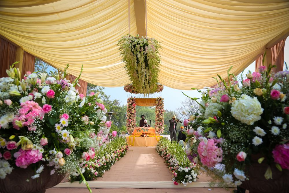 Photo of Entry walkway decorated with flowers on either side.