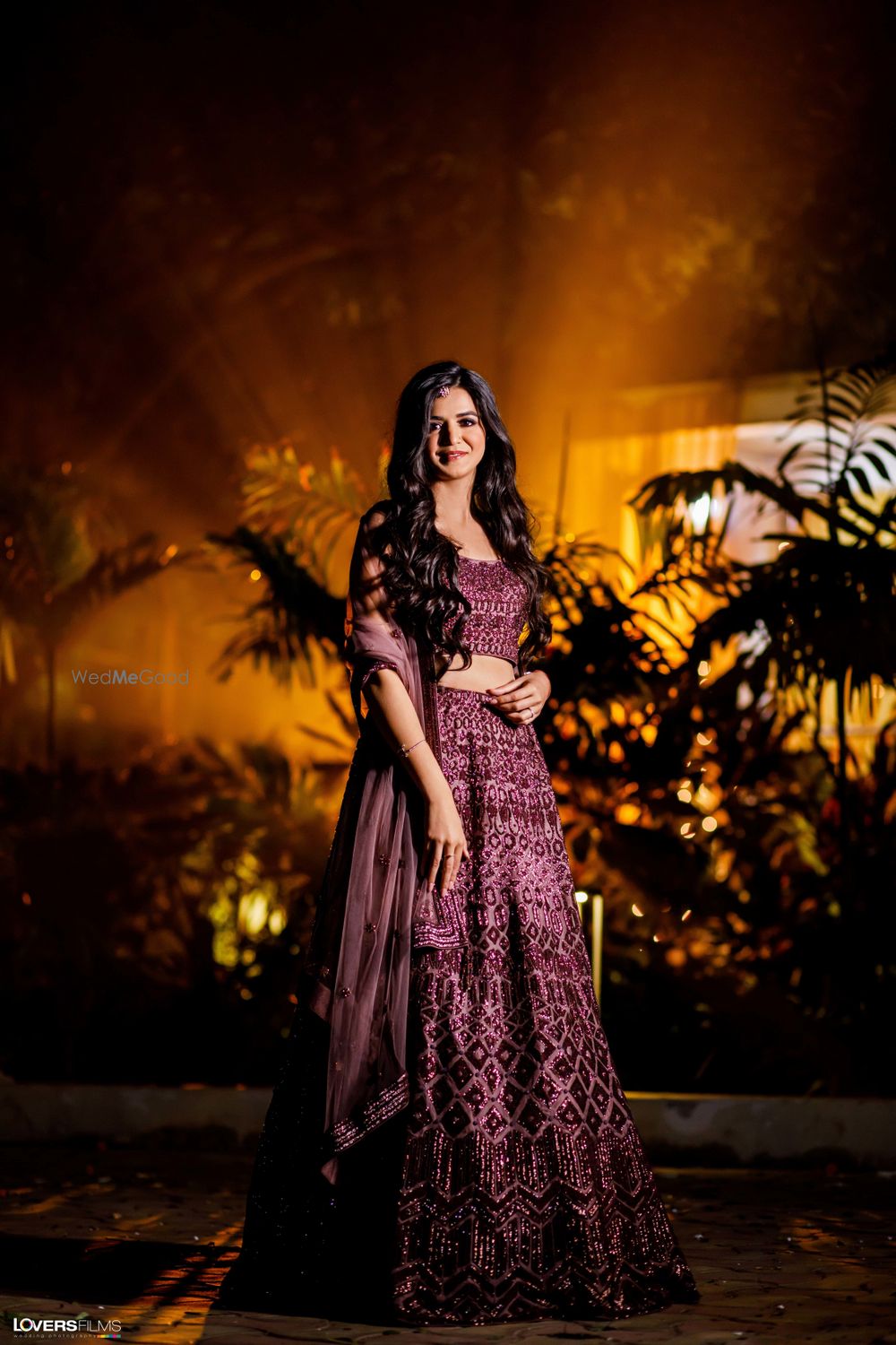 Photo of purple sangeet lehenga with open hair