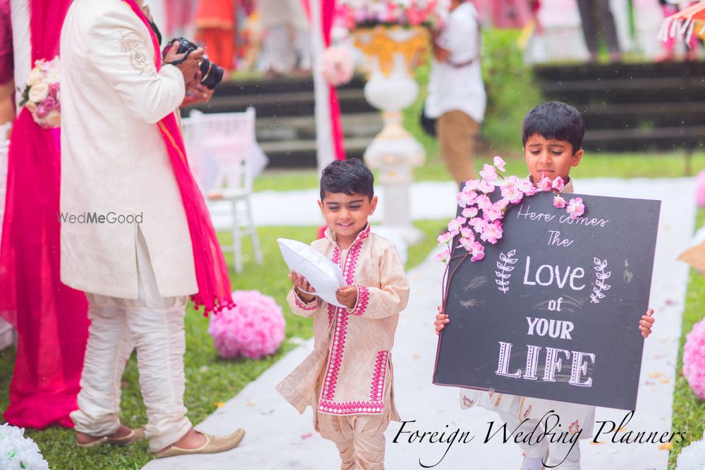 Photo of Flower Boys Holding Personalised Message Boards