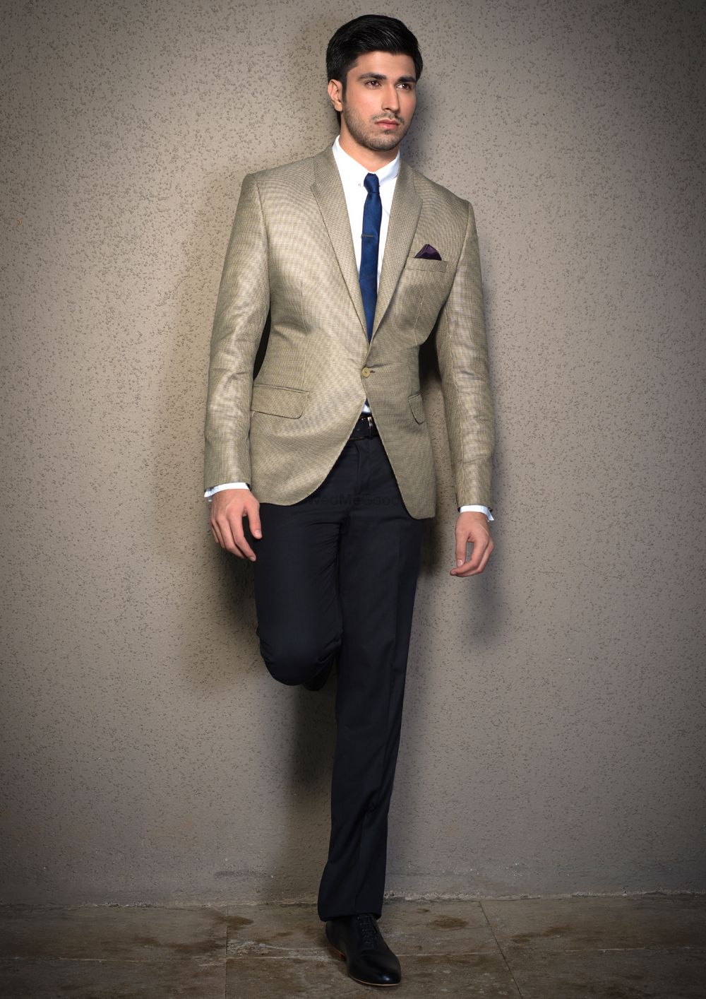 Photo of steel grey silver suit with slim tie with white shirt and navy pants