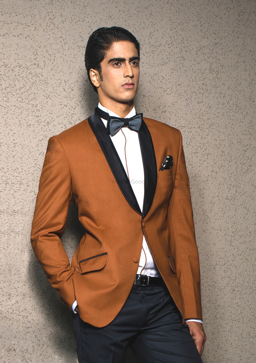 Photo of brown tux with black lapels and bow tie