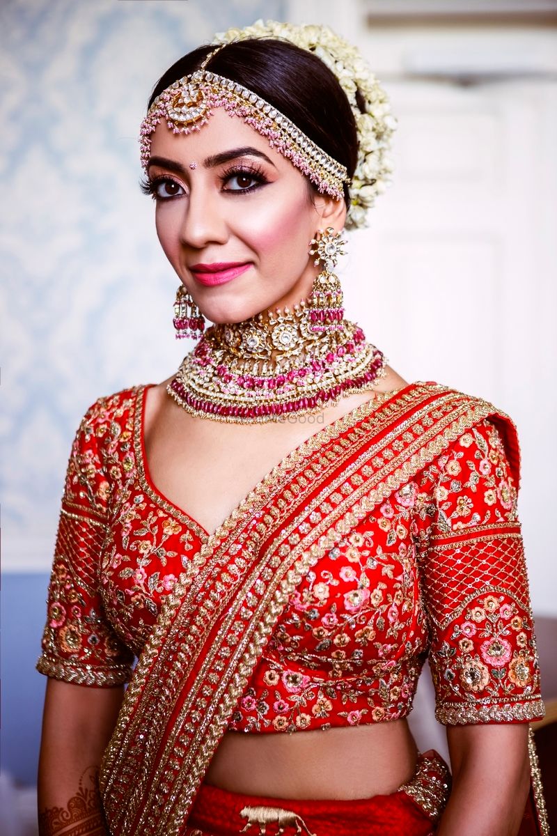 Photo of polki jewellery with red sabyasachi lehenga