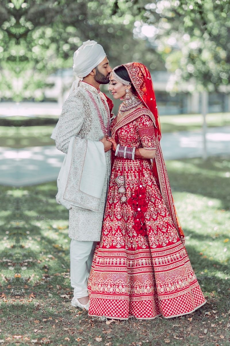 Photo of romantic couple portrait with bride and groom in contrasting colours