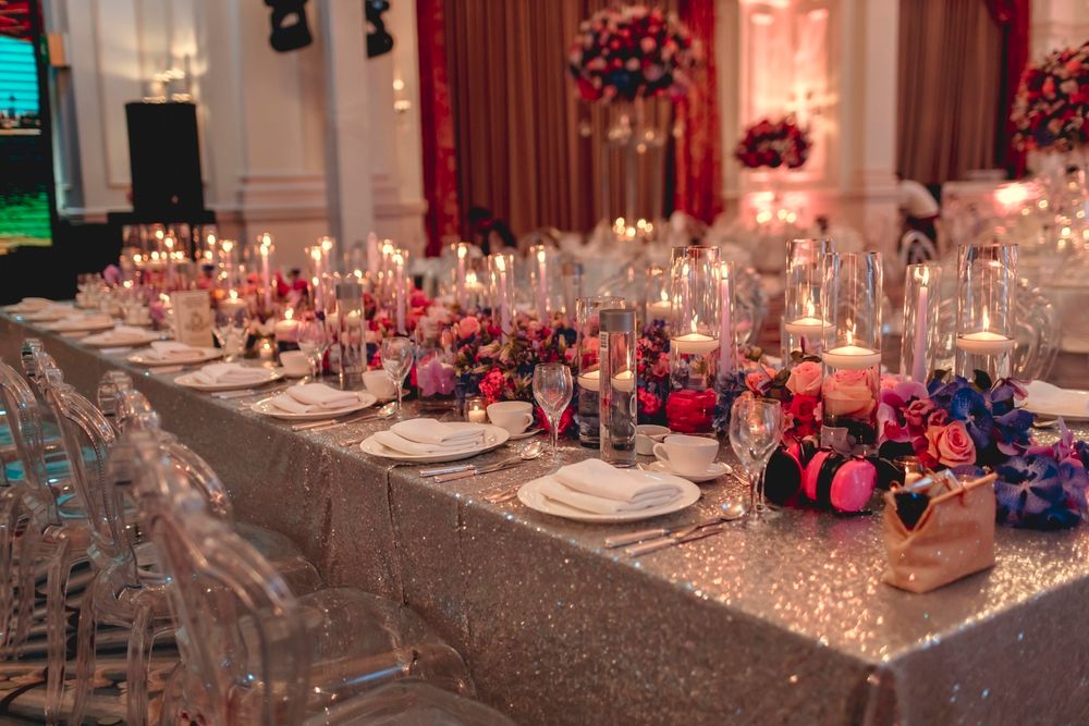 Photo of long table elegant setting for reception or sangeet