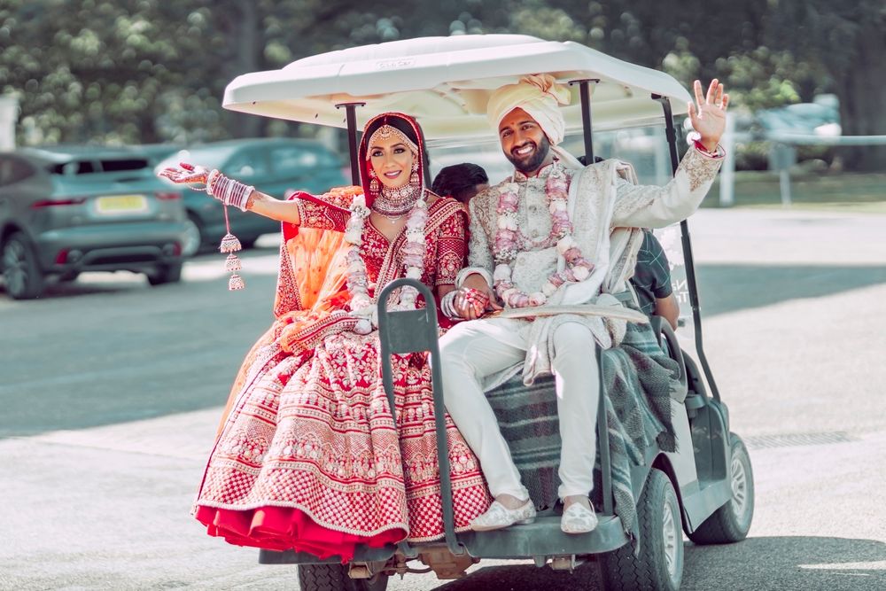 Photo of post wedding shot couple exit in golf cart