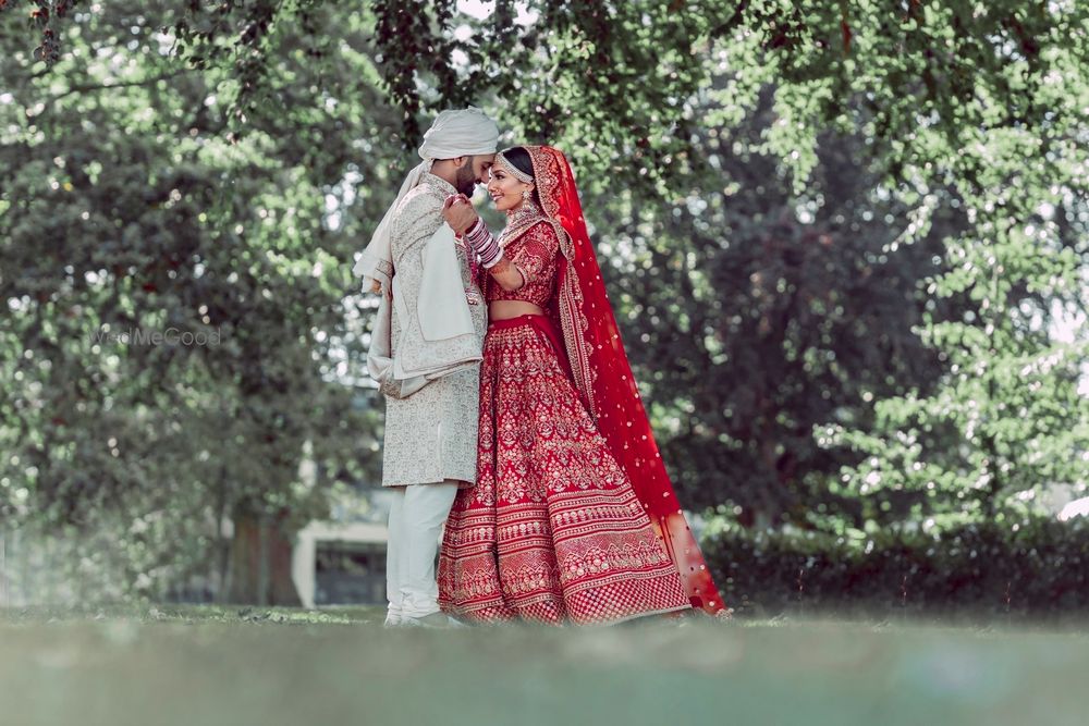 Photo of contrasting bride and groom shot outdoors