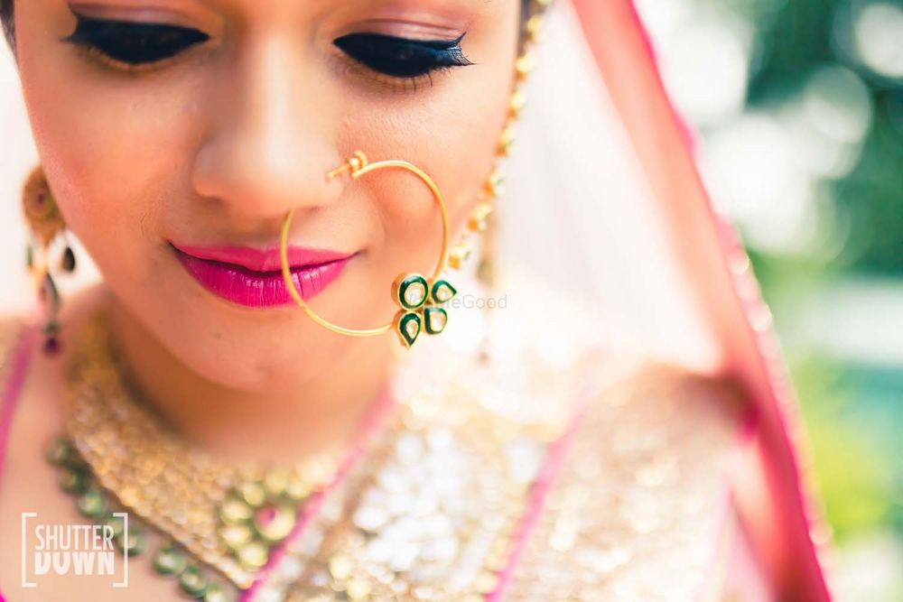 Photo of Pink bridal makeup with nosering