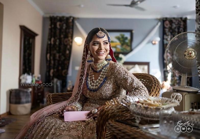 Photo of Candid shot of a bride smiling on her wedding day.