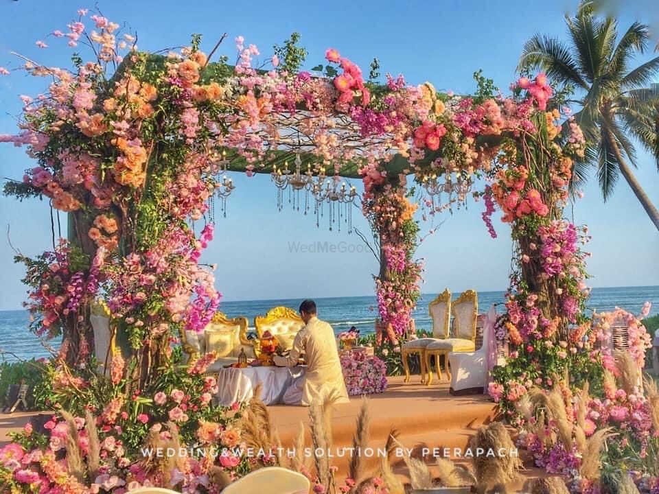 Photo of Pretty floral mandap by the sea