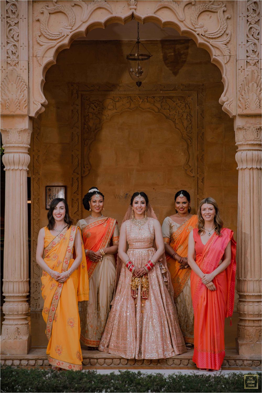 Photo of Bride posing with her squad.