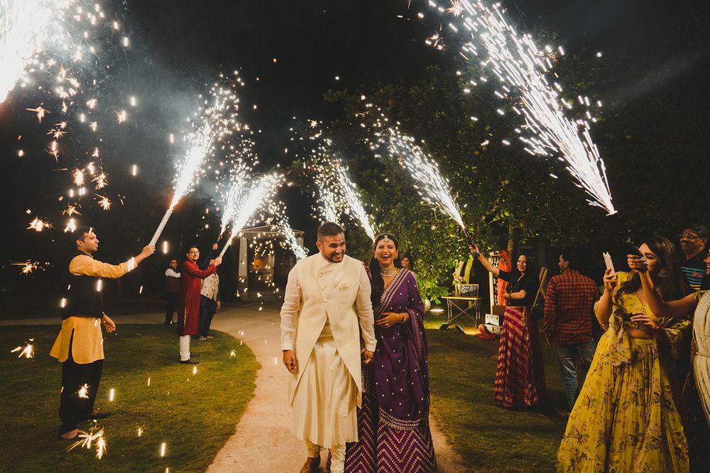Photo of couple entry with cold pyros for their reception