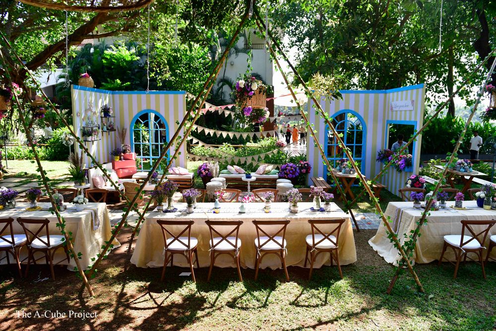 Photo of Outdoor table settings with teepee tents.
