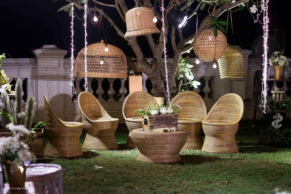 Photo of Upturned baskets and cane chairs for outdoor decor.