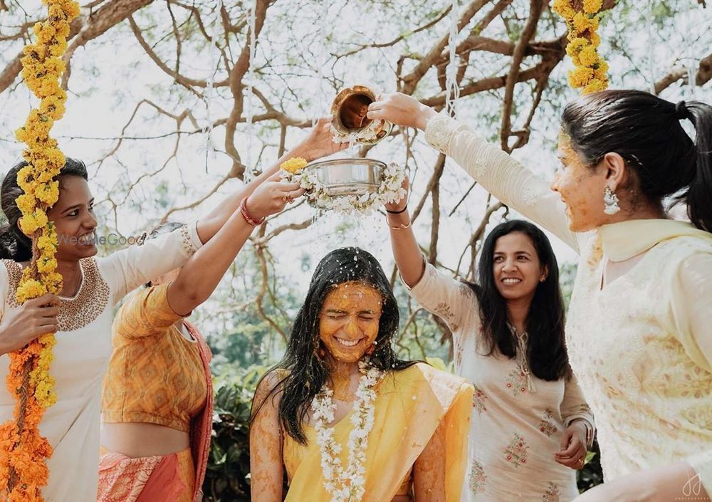 Photo of Fun haldi shot with bridesmaids.