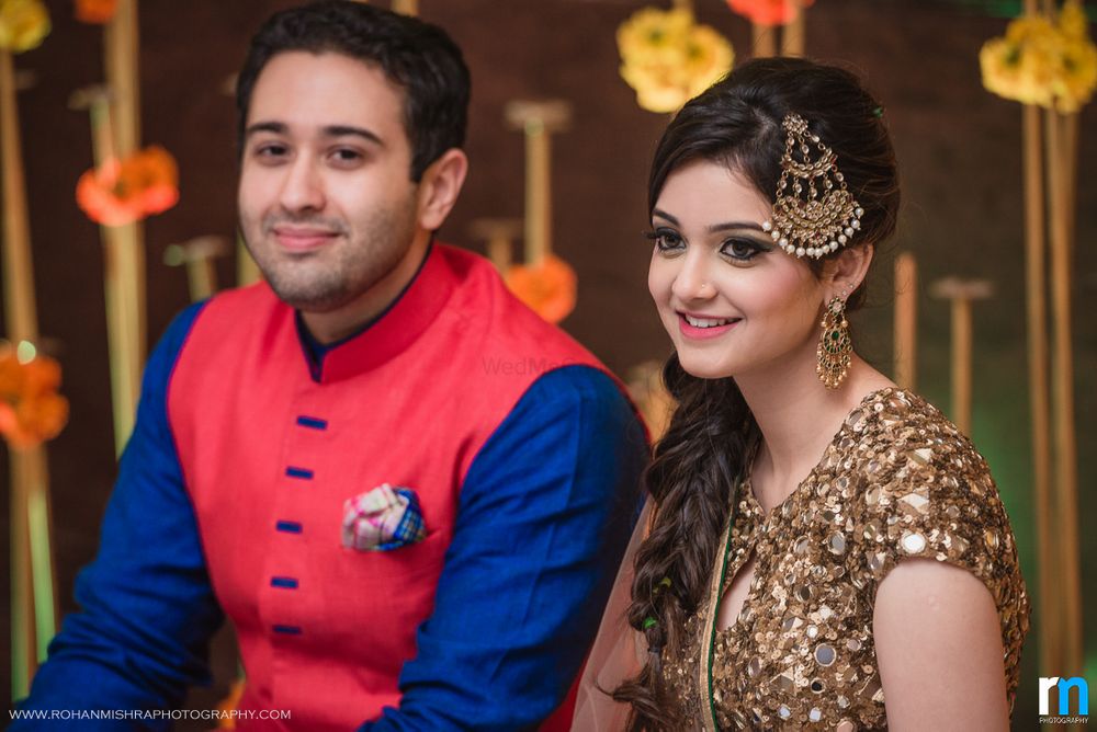 Photo of Bride with Dull Gold Outfit and Jhoomer on Engagement