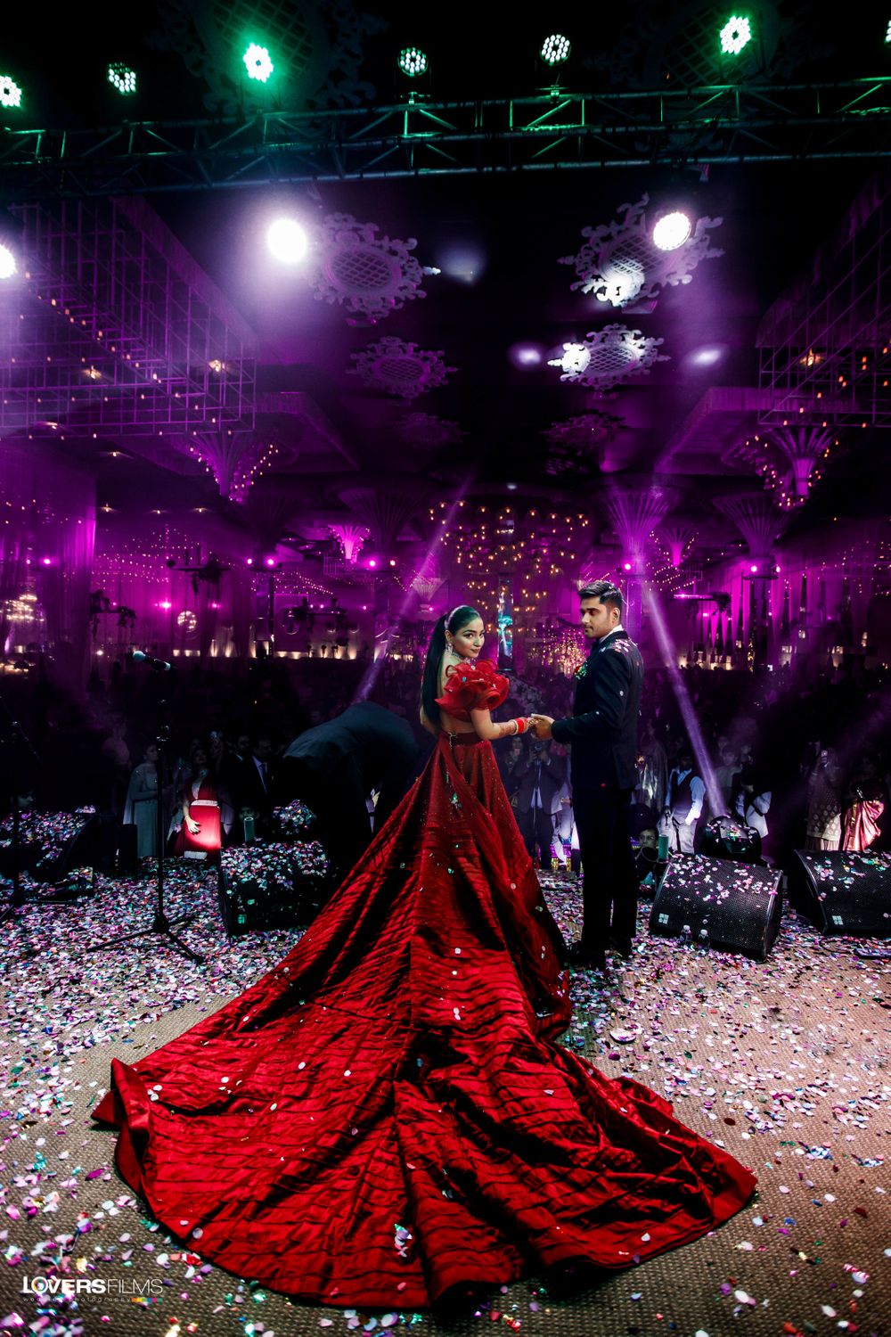 Photo of gaurav gupta gown in red with a long train