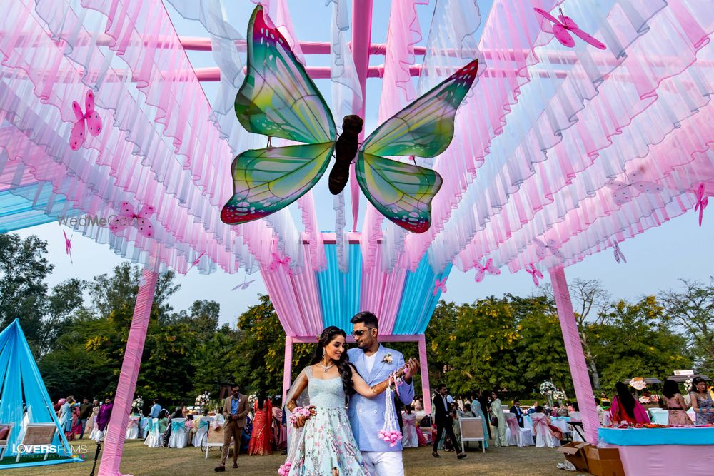 Photo of unique butterfly theme mehendi decor with large prop