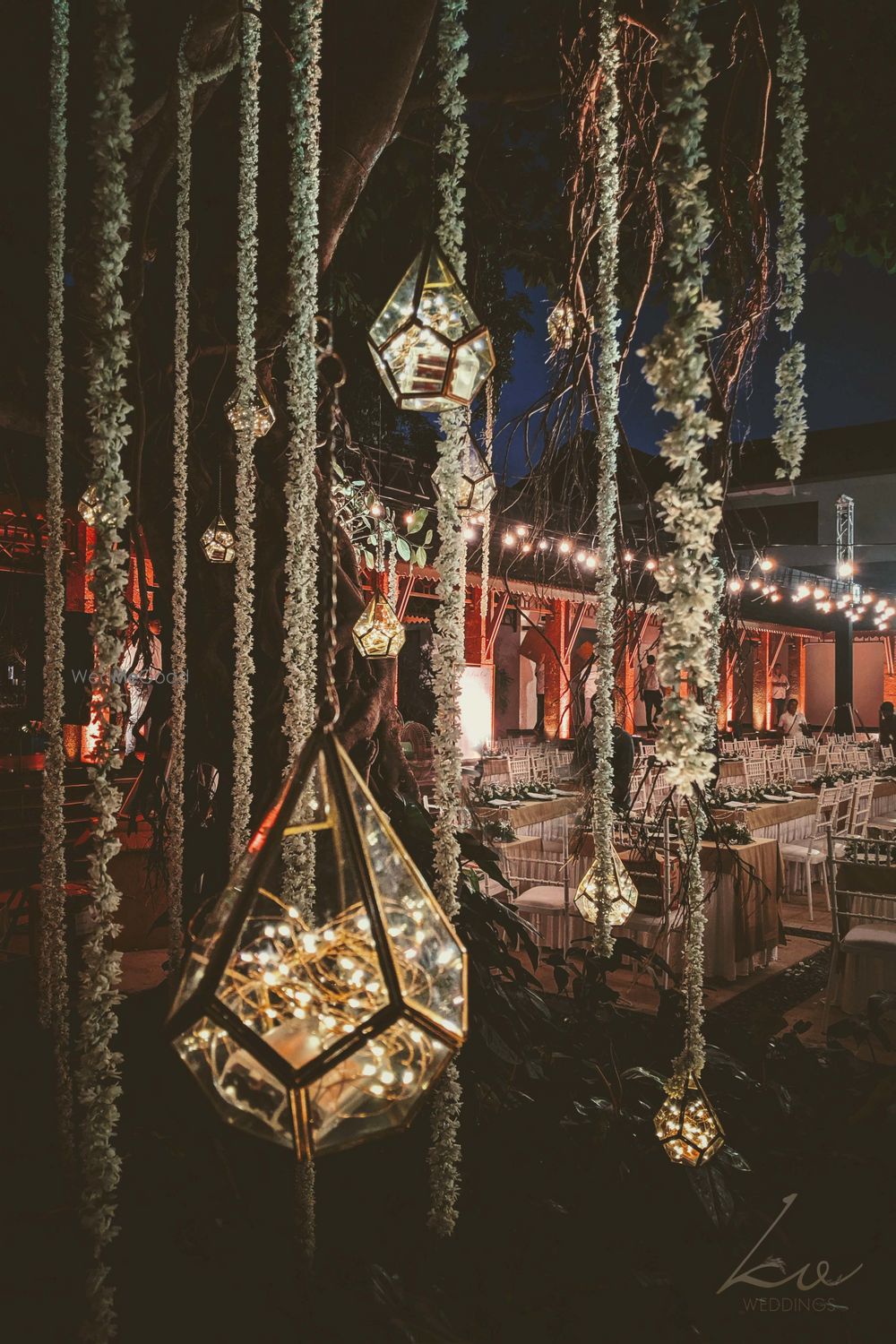 Photo of Hanging terrariums with mogra strings.