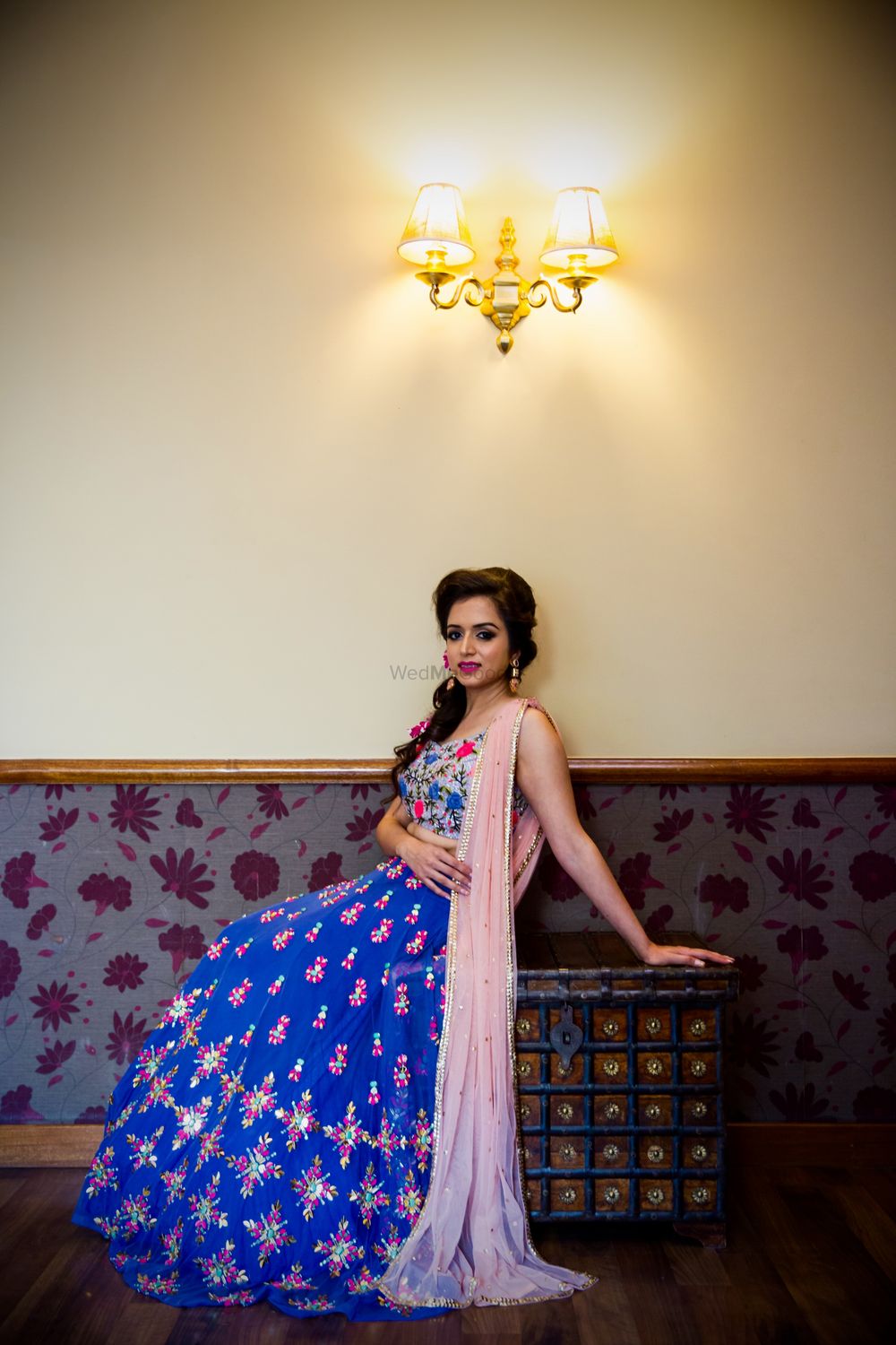 Photo of floral threadwork lehenga in blue and peach
