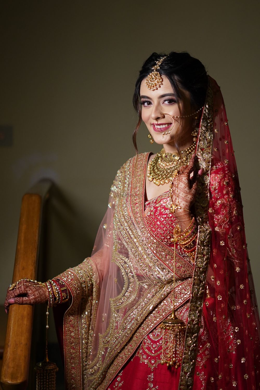 Photo of Bride wearing a red lehenga on the wedding day.