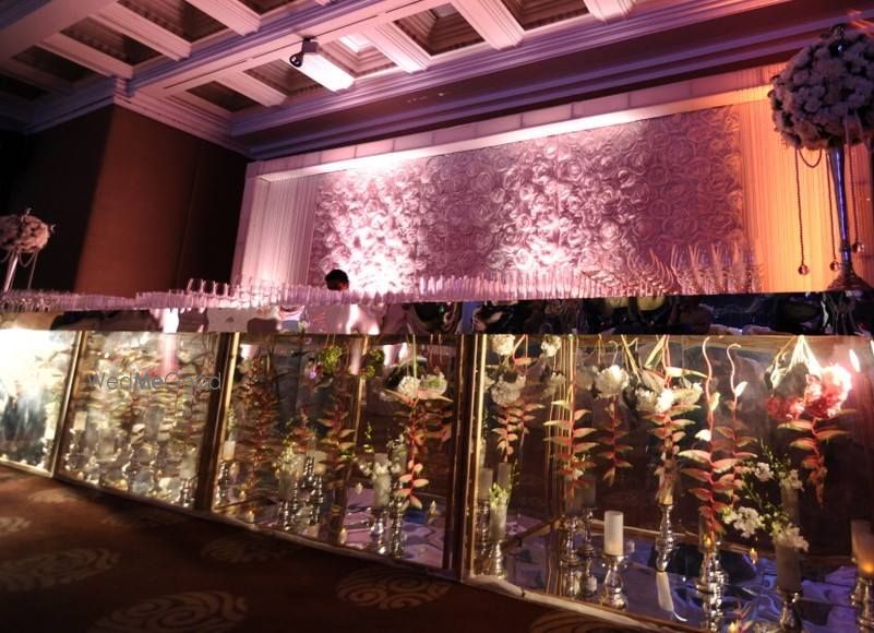 Photo of bar decor with see through glass and florals inside the glass