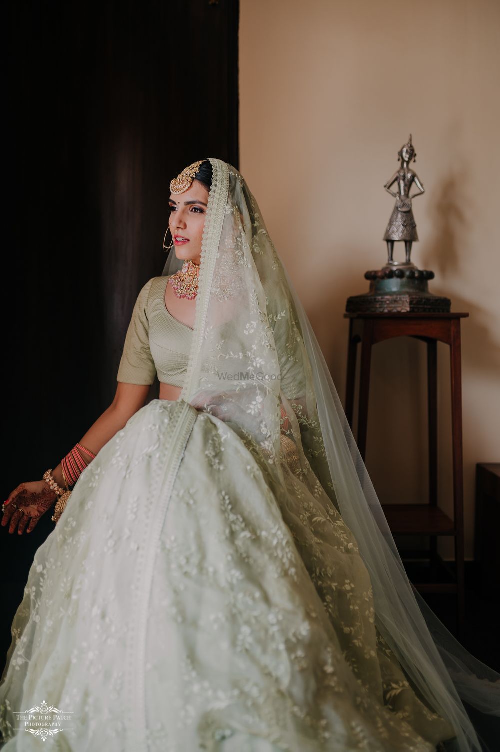 Photo of Bride wearing a pale green lehenga